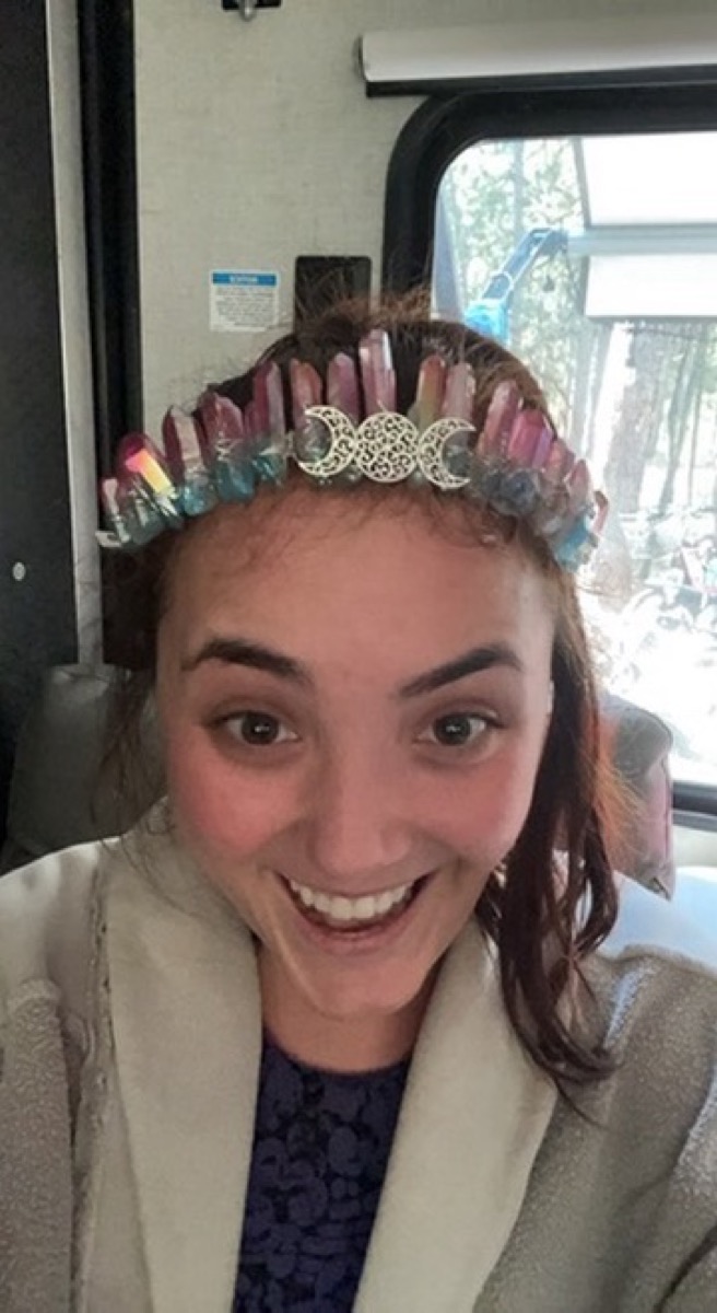 Bella grinning in a crystal crown